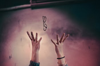 Person Tossing It's Eyeglasses