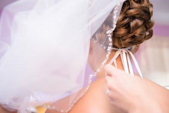 Person Tying Brides Veil