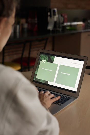 Person Typing at Laptop