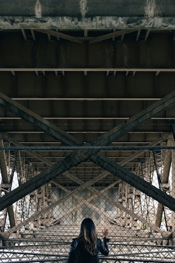 Person Under Bridge