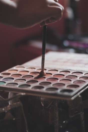 Person Using A Makeup Brush