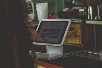 Person Using a Turned-on Tablet Computer
