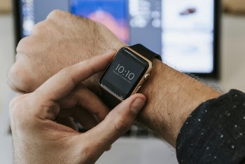 Person Using Apple Watch