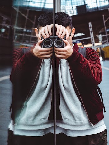 Person Using Black Camera
