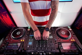 Person Using DJ Mixer