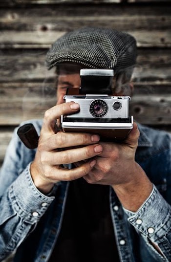 person using gray camera