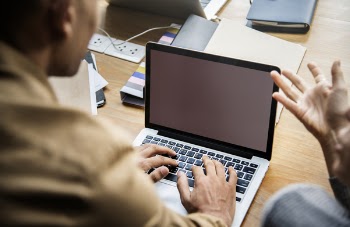 Person Using Gray Laptop Computer