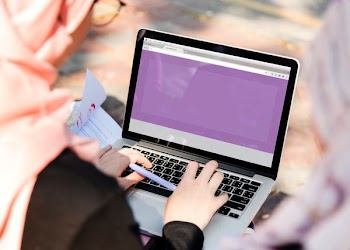 person using laptop computer