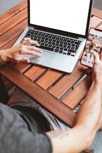 Person Using Macbook and Iphone X