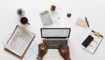 Person Using Macbook Pro on Table