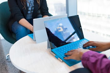 Person Using Microsoft Windows 3 on Table