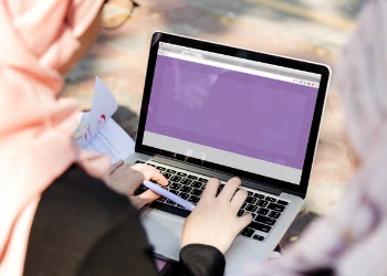 Person Using Silver and Black Laptop Computer