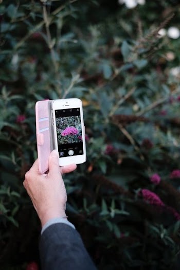 person using silver iPhone