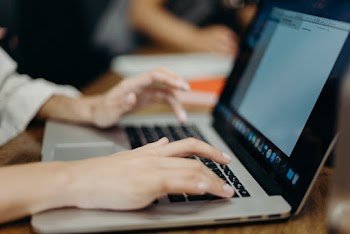 Person Using Silver Macbook Pro