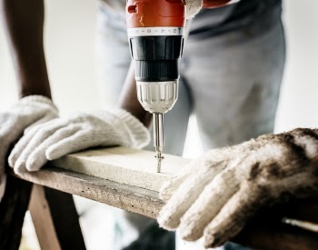 Person Using the Red Hand Drill