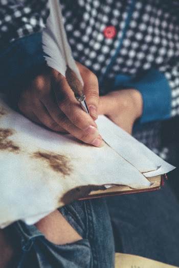 Person Using White Pen