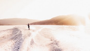 Person Wakeboarding on Lake