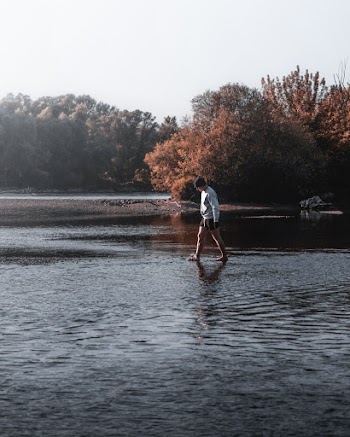 Person Walking in Water