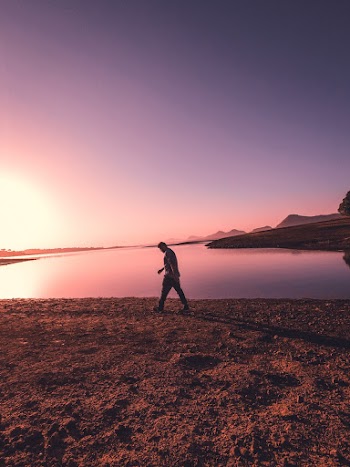 Person walking near a water body