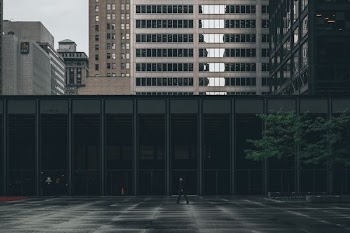 person walking near building during daytime