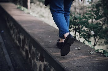 Person Walking on Footpath