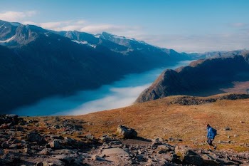 person walking on mountain