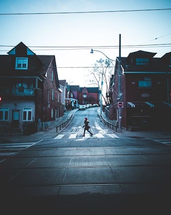 person walking on pedestrian lane