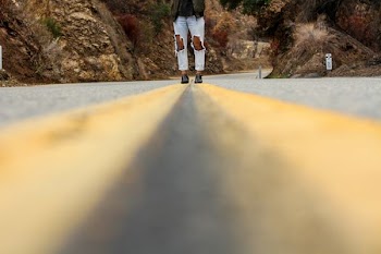 person walking on road