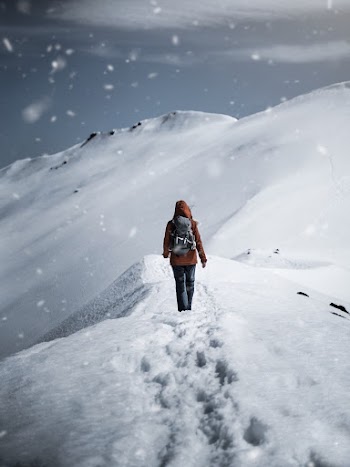 Person Walking on Snow