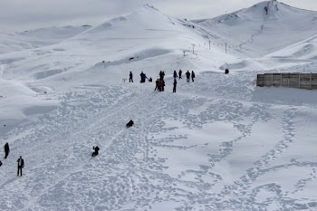 Person Walking on Snowfield