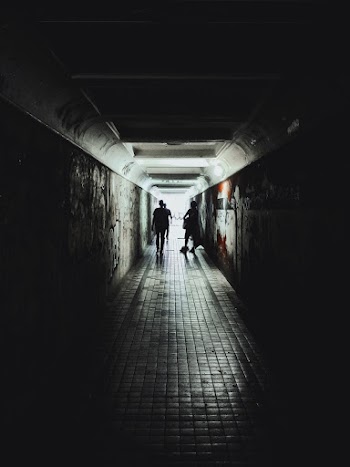 Person Walking on Tunnel