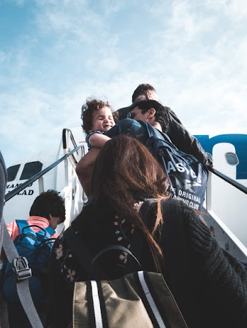 Person Walking Towards Airplane