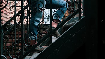 Person Walking Up to the Stairs