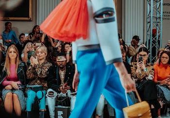 person walking while holding handbag