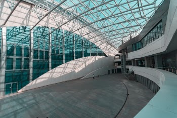 Person Walks Inside Glass Structure