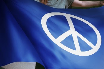 Person waving blue flag with peace | Free Photo - rawpixel