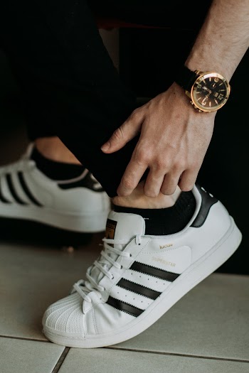 Person Wearing Adidas Superstar