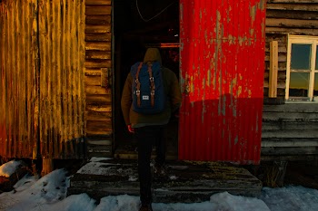 Person Wearing Beanies and Blue Rucksack