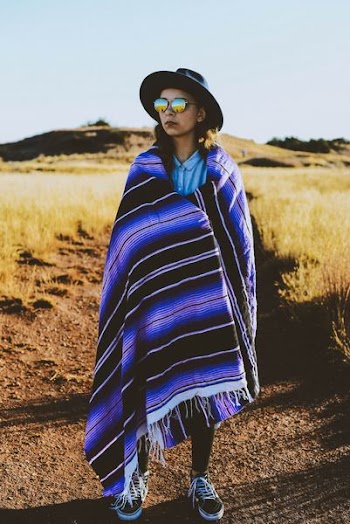 person wearing black and purple poncho
