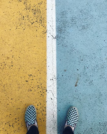 Person Wearing Black-and-white Checkered Slip-on Shoes