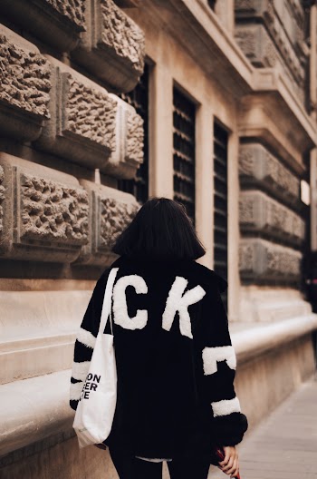 Person Wearing Black and White Jacket
