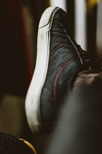 Person Wearing Black and White Low-top Sneaker