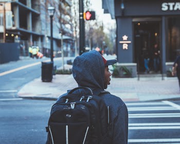 Person Wearing Black Backpack About to Cross Pedestrian