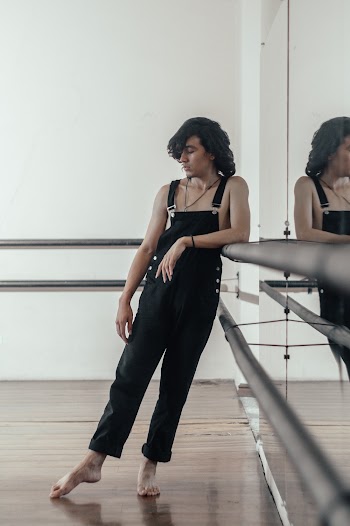 Person Wearing Black Dungarees