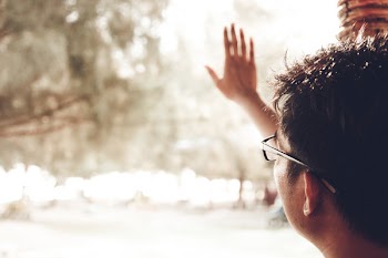 Person Wearing Black Framed Eyeglasses