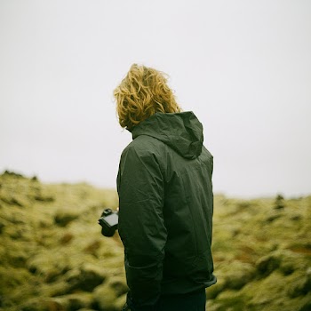 Person Wearing Black Hooded Jacket