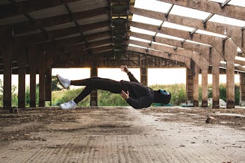 Person Wearing Black Hoodie Floating On Air