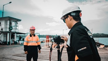 Person Wearing Black Jacket Holding Camera