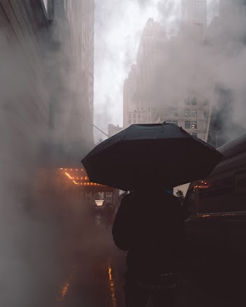 Person Wearing Black Jacket Using Black Umbrella