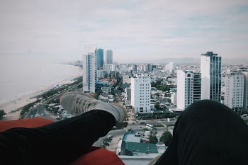 Person Wearing Black Jeans and White Sneakers